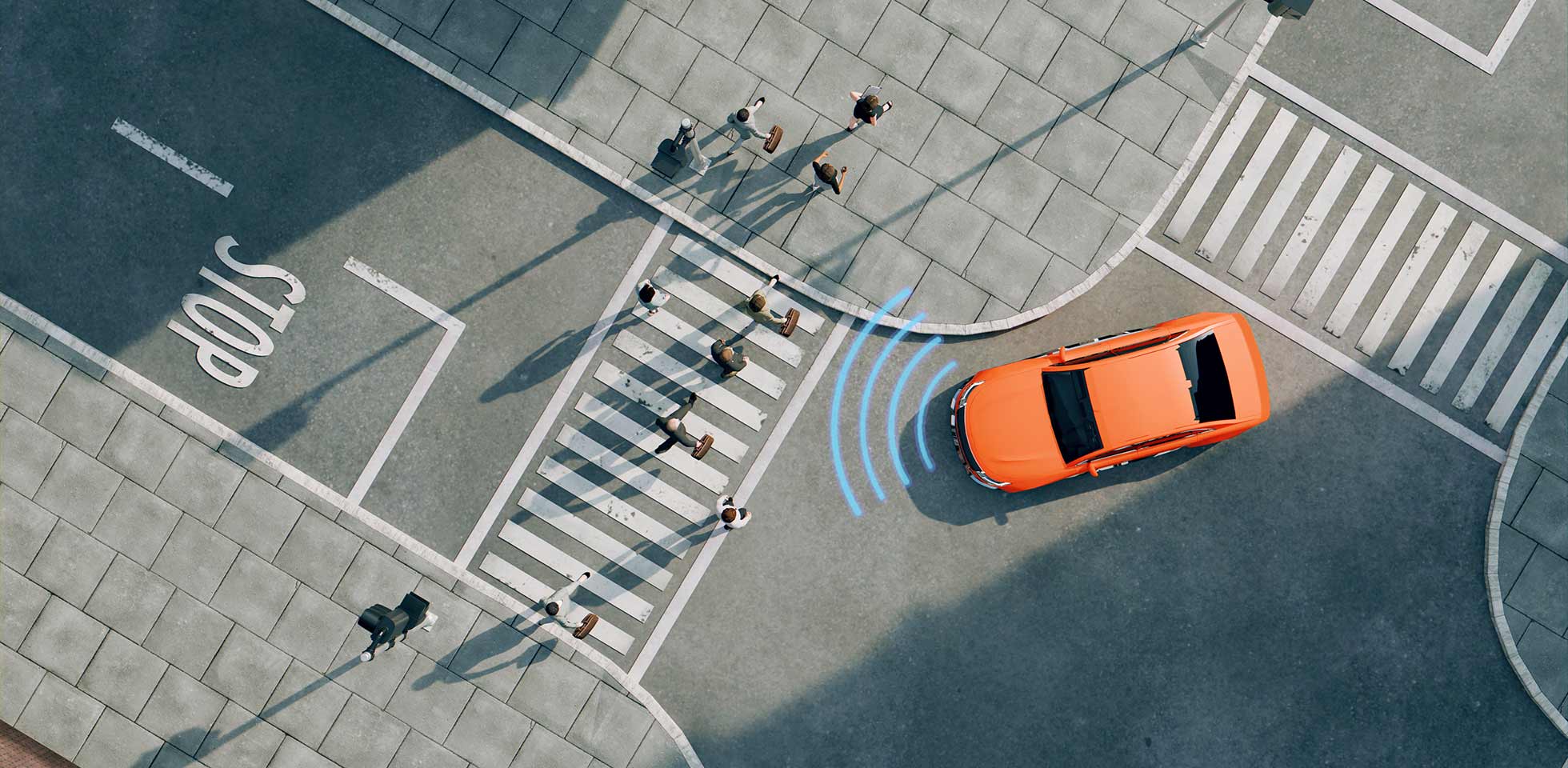 luftaufnahme eines leuchtend orangefarbenen autos,  auf einer straße fährt. das auto steht neben einem fußgängerüberweg  vor einer haltelinie  dem auf  straße gemalten wort „stop“. das auto verwendet sensoren  radar, um  fußgänger zu erkennen. konzept einer neuen autotechnologie  dem autonomen fahren. symbolbild verkehrsdaten