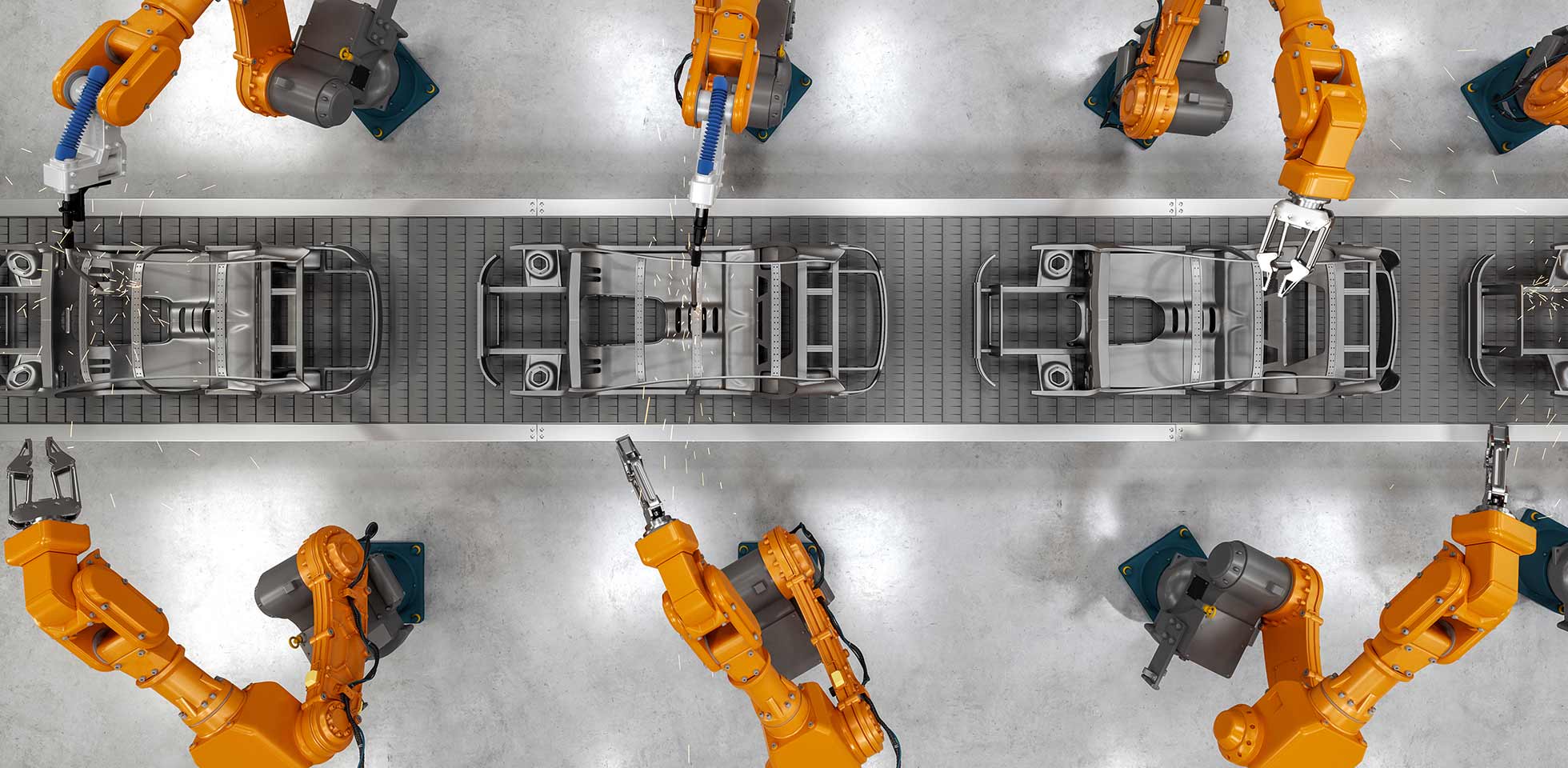 draufsicht auf industrielle schweißroboter an  fertigungsstraße einer automatisierten automobilfabrik. symbolbild digitaler zwilling