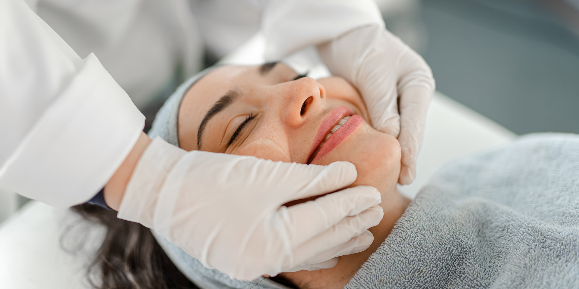 happy man receiving a beauty treatment stock photo
