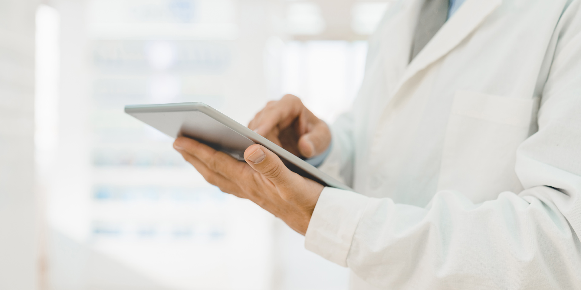 cropped closeup shot of male pharmacist druggist chemist using digital tablet for checking online medicines remedy pills painkillers availability, transformation