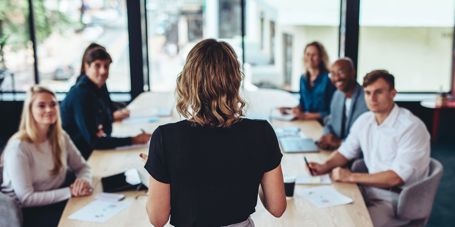 businessman addressing a meeting in office, female leaship