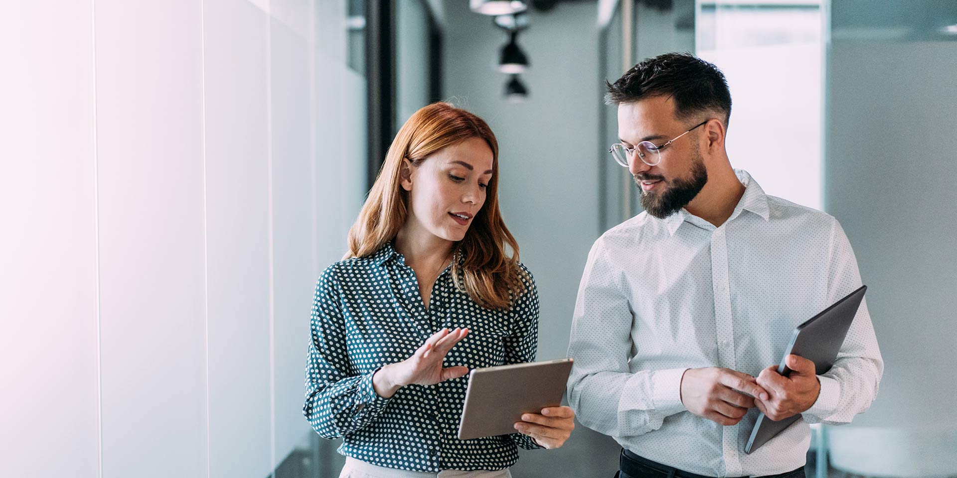 shot of t corkers having a discussion in mon office. businessman and businessman in meeting using digital tablet and discussing business strategy. confident business people rking together in the office. creative business persons discussing new project and sharing ideas in the rkplace. technologie