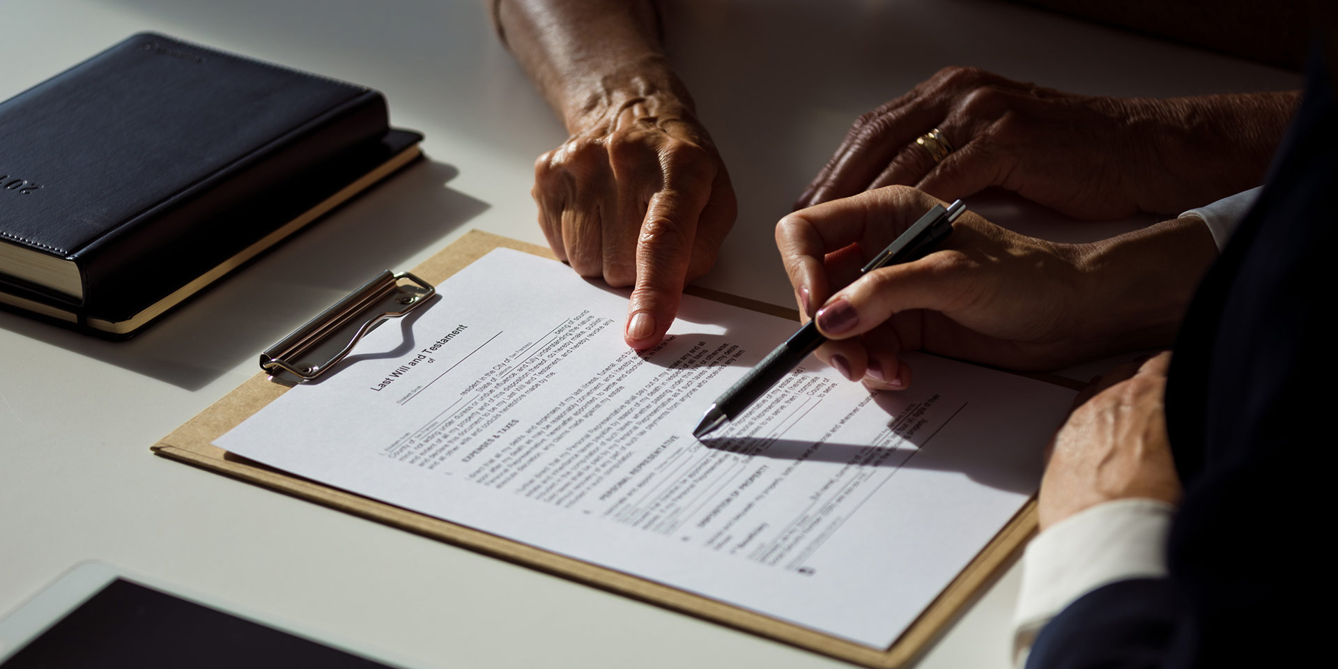 senior man discussing the will with lawyer, jurist